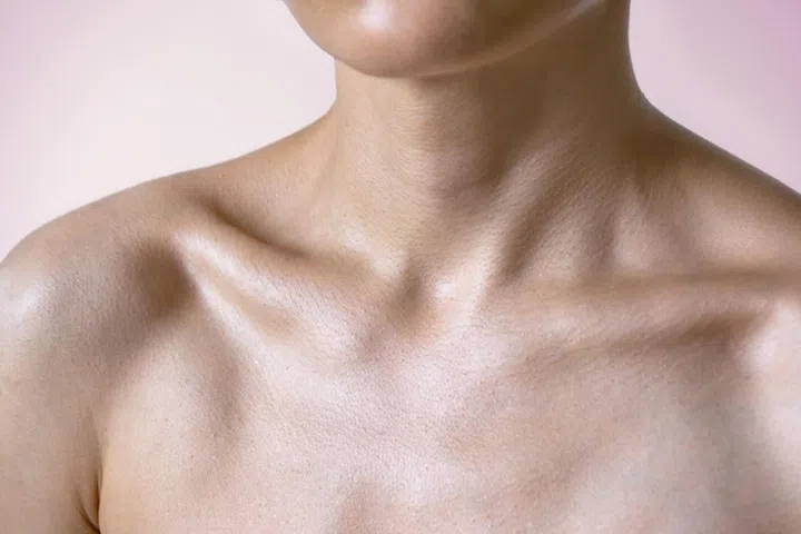 Cropped view at woman chest with middle age skin. Close up 