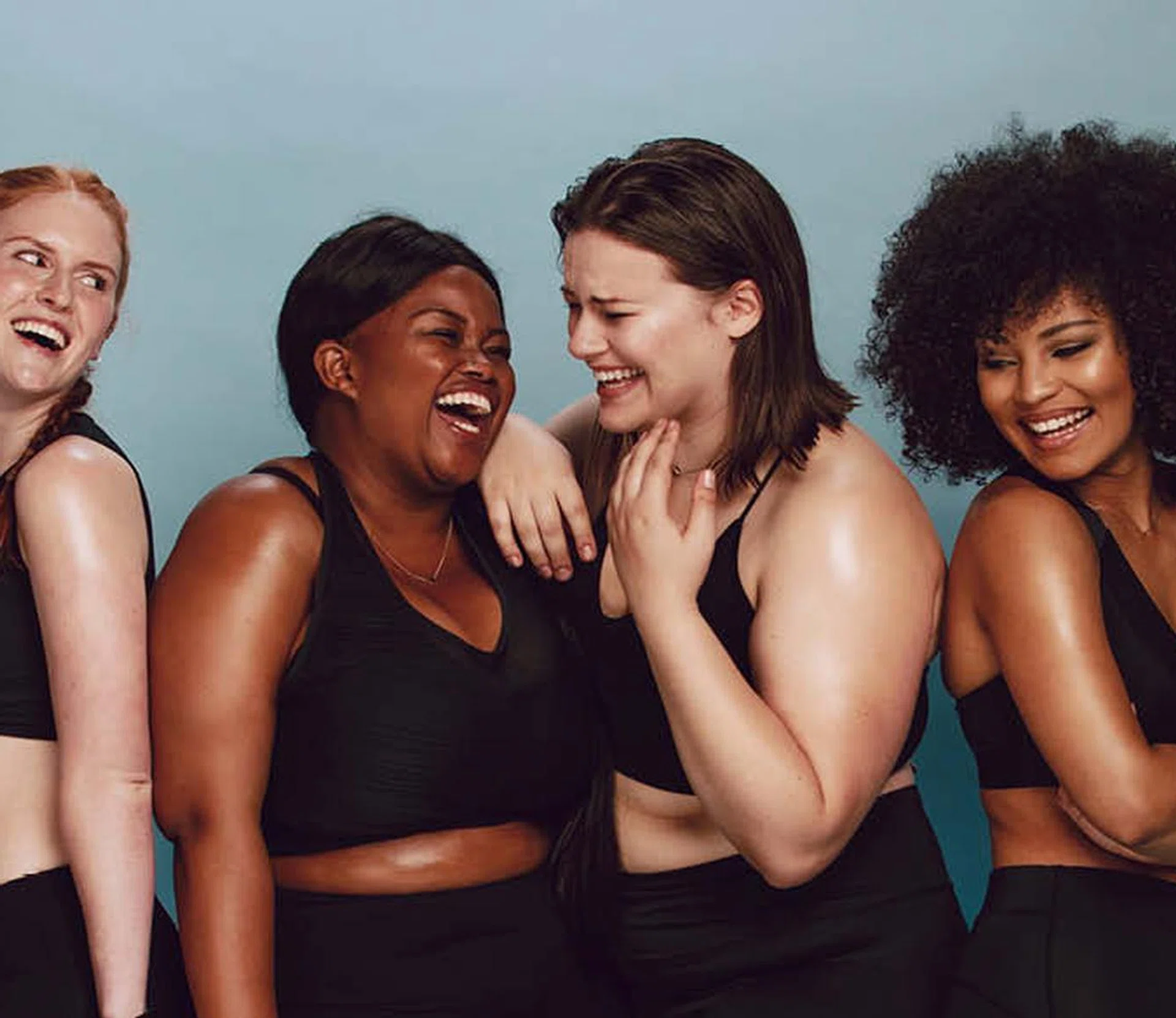 An image of four women of different ethnicity in sports wear. For a story that features high-tech body treatments like firming, anti-cellulite and fat-freezing.