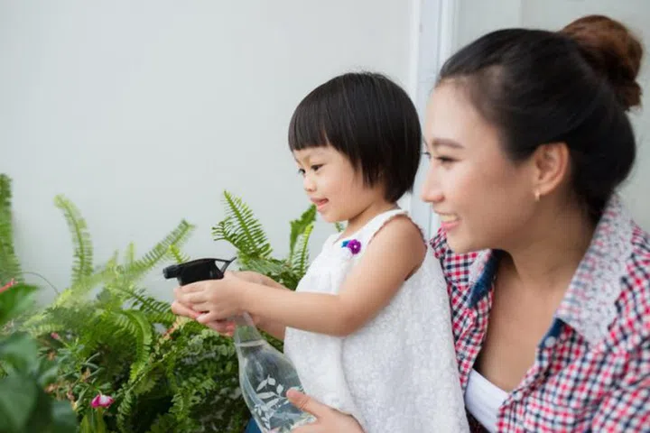 Mother and toddler daughter's spring gardening