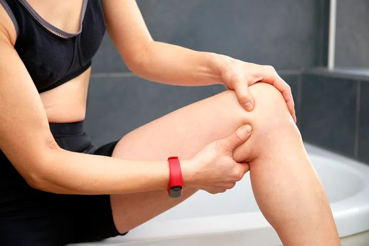 massaging twisted  knee injury