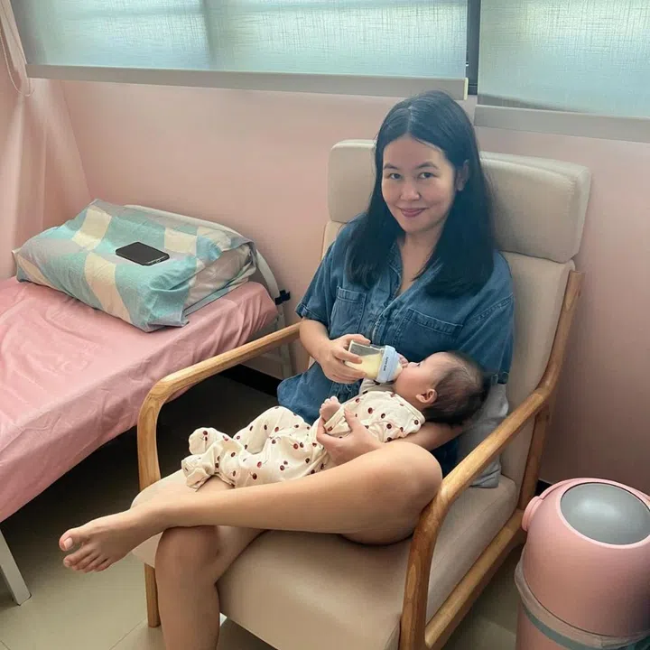 Rebecca Rachel Wong bottle feeding baby