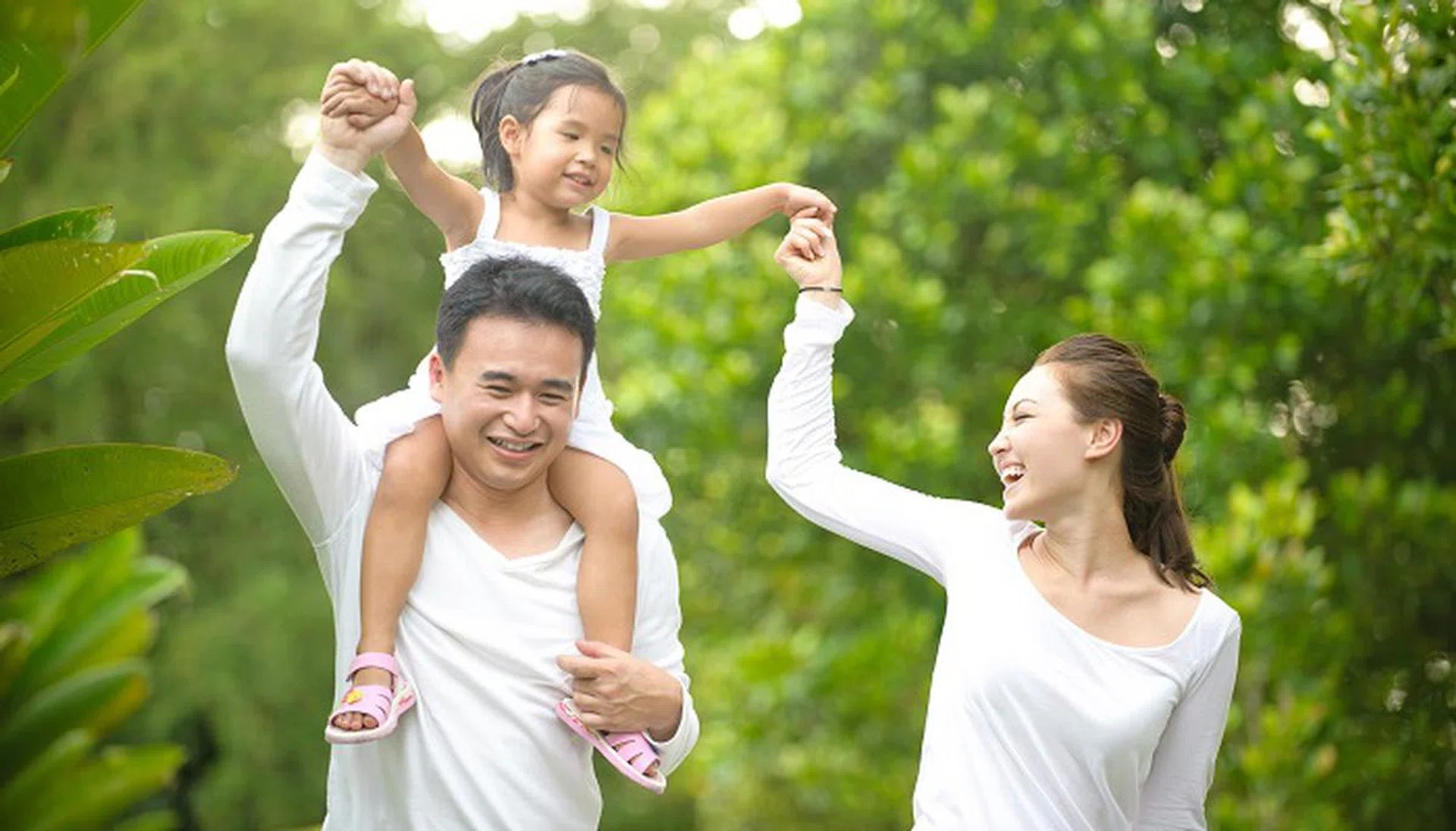 30283282 - happy asian family enjoying family time together in the park