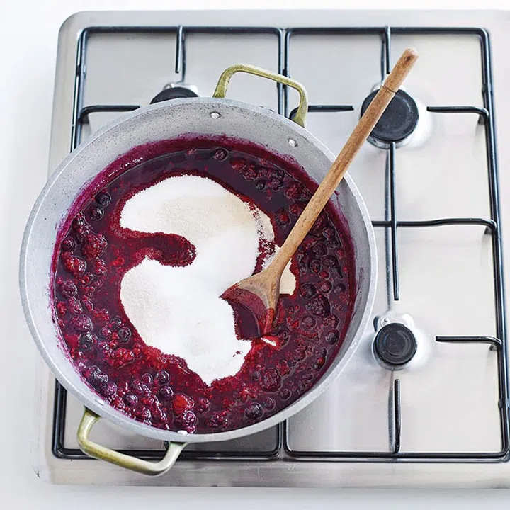 03. Add warm sugar and Jam Setta to the berry mixture. Boil, uncovered, for about 20 mins or until jam jells when tested.