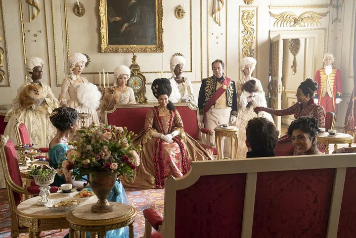 Bridgerton. (L to R) Simone Ashley as Kate Sharma, Golda Rosheuvel as Queen Charlotte, Jonathan Bailey as Anthony Bridgerton, Hugh Sachs as Brimsley, Charithra Chandran as Edwina Sharma, Adjoa Andoh as Lady Danbury in episode 205 of Bridgerton. Cr. Liam Daniel/Netflix © 2022