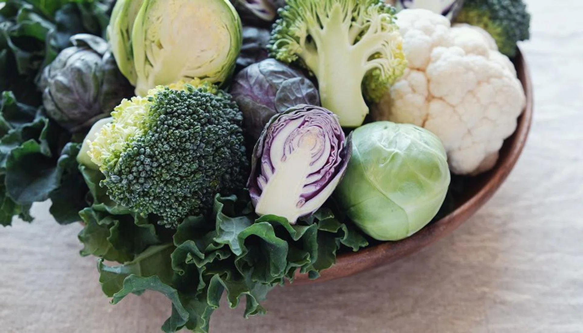 cruciferous vegetables, cauliflower,broccoli, Brussels sprouts, kale in wooden bowl, reducing estrogen dominance, ketogenic diet