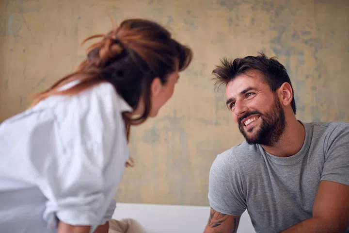 Smiling man looking seduce loving woman.