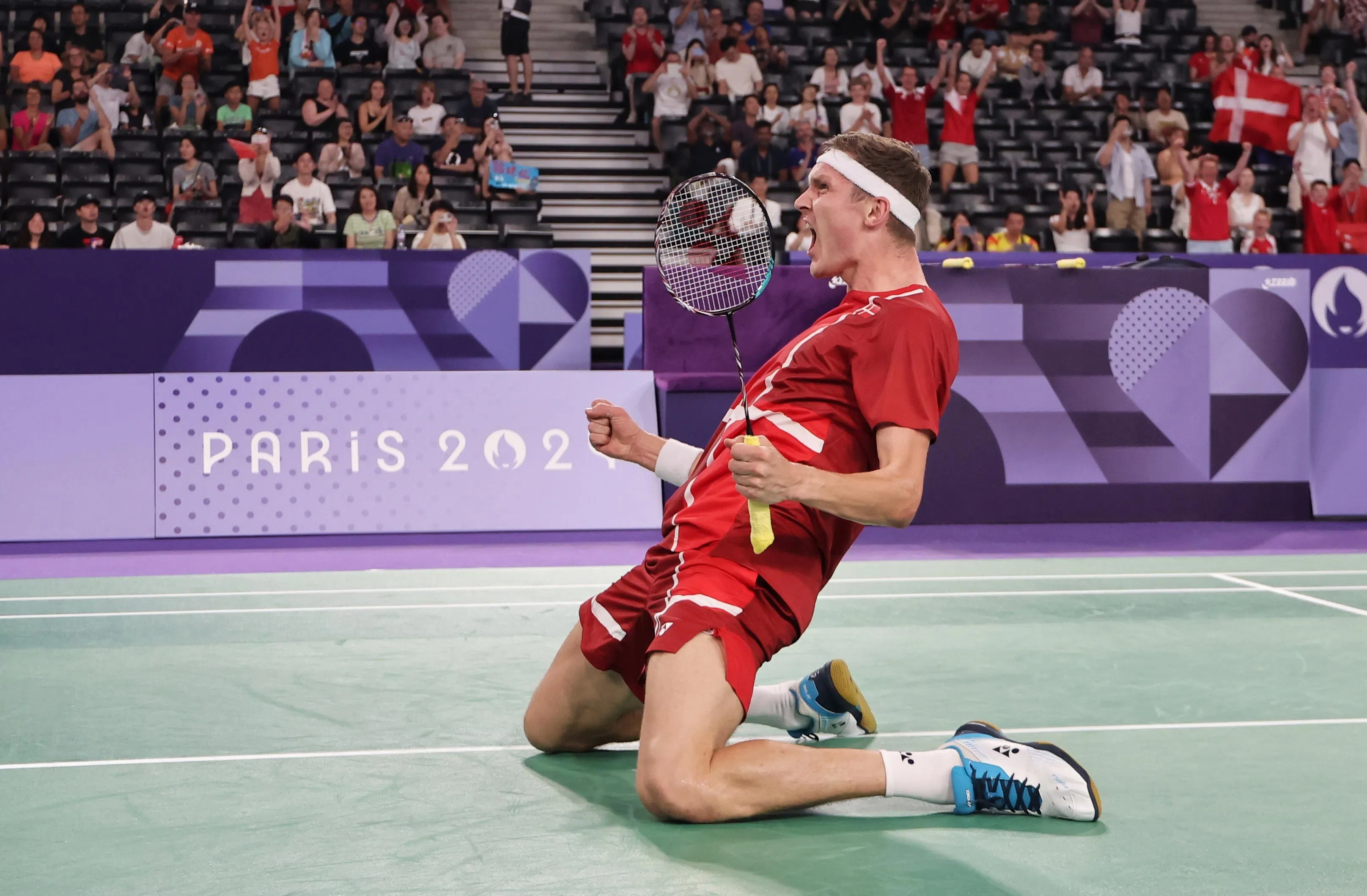 安赛龙在战胜骆建佑后，激动庆祝。（谢智扬摄）