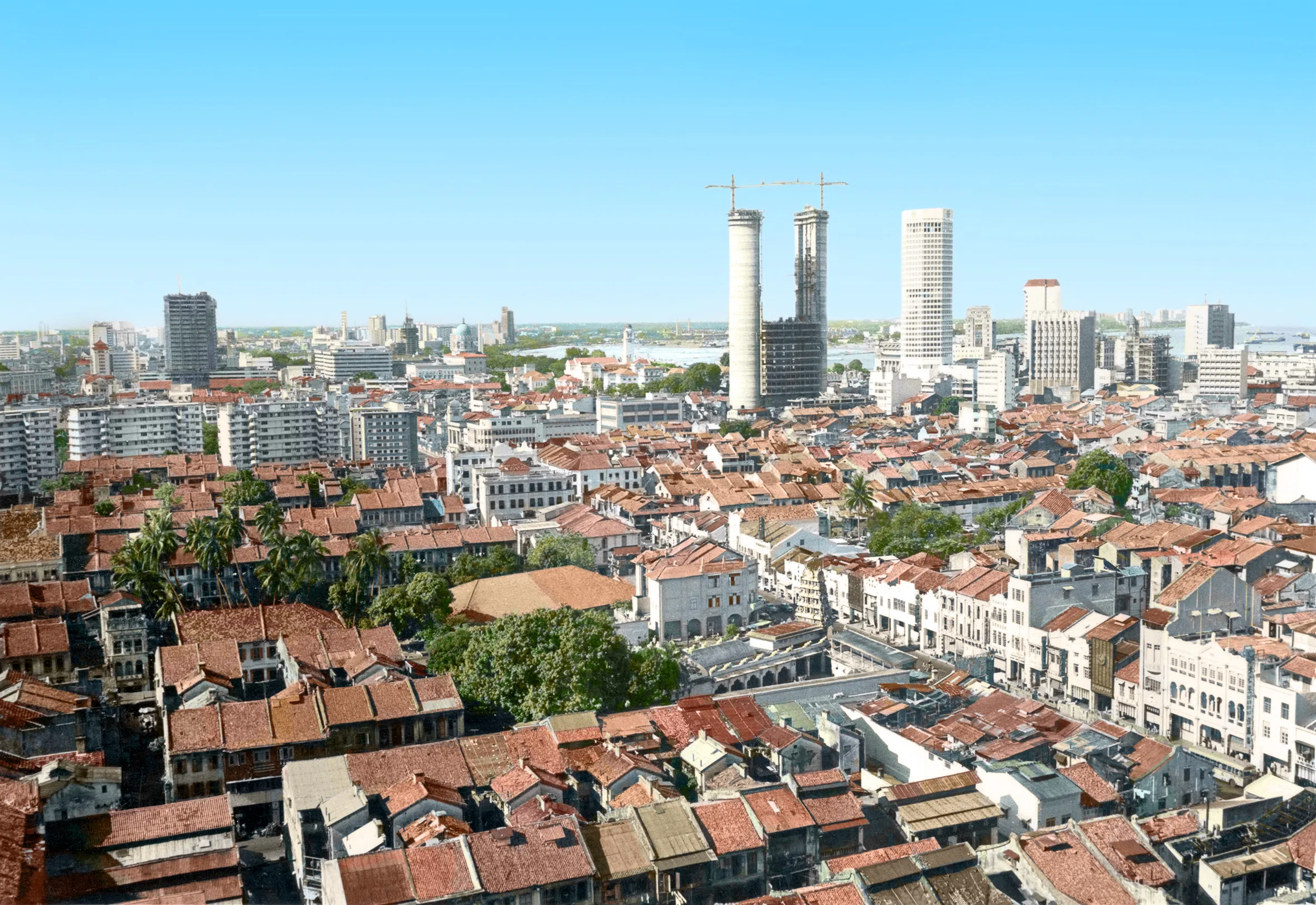 1970年代，新加坡河畔的部分老屋被拆除，建起现代高楼大厦。（徐宗懋图文馆）