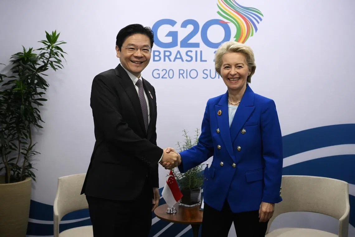 总理兼财政部长黄循财（左）11月18日与欧盟委员会主席冯德莱恩（右）在二十国集团峰会期间举行会谈。（海峡时报）