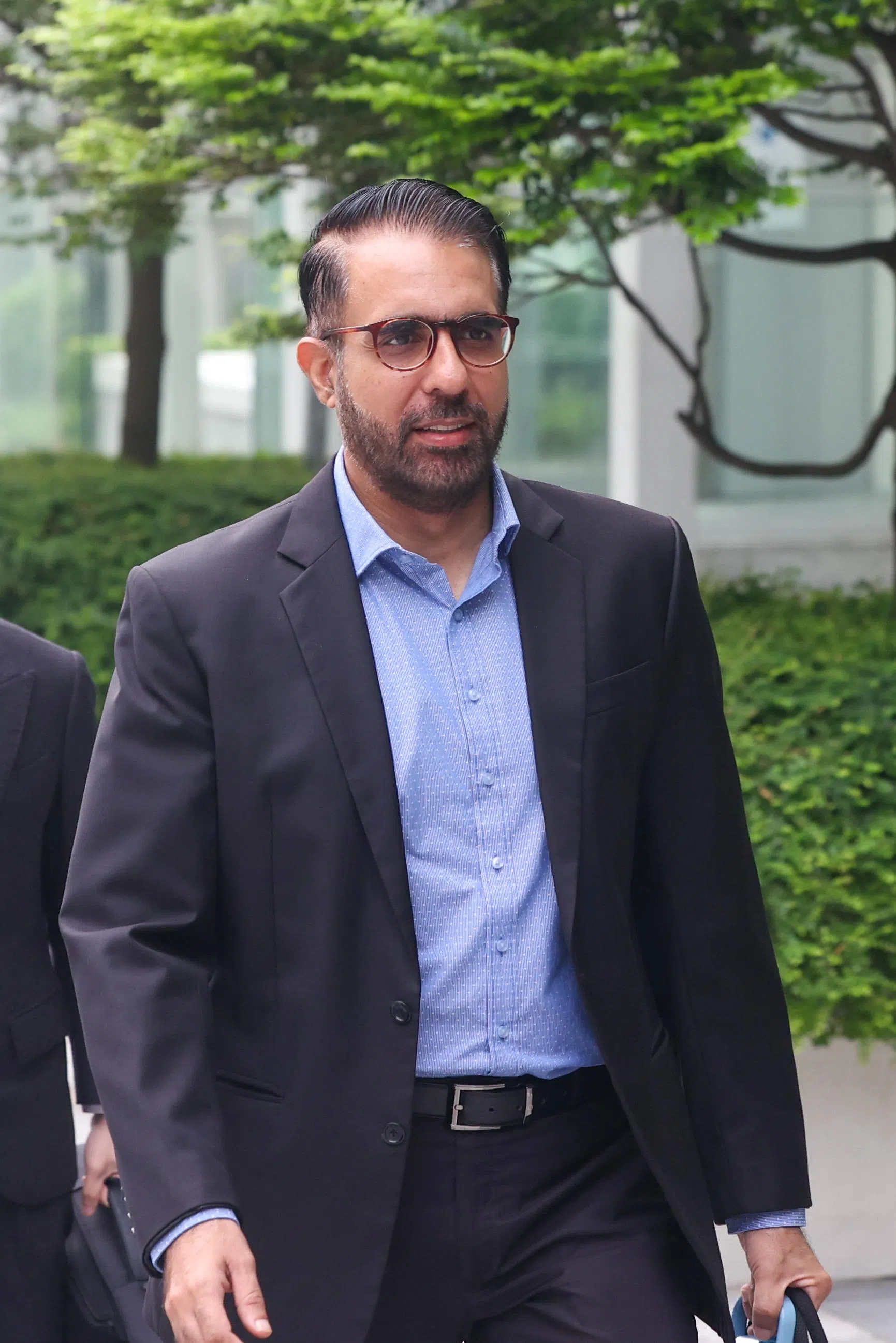 工人党秘书长毕丹星星期四（10月17日）上午抵达国家法院大厦。（陈斌勤摄）