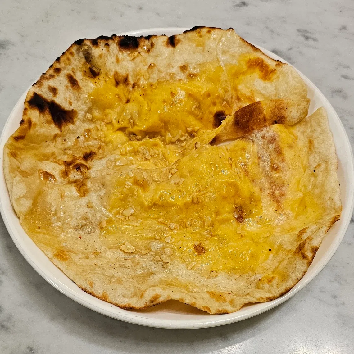 印度馕饼打包外带依旧脆口。（黄亿敏摄）