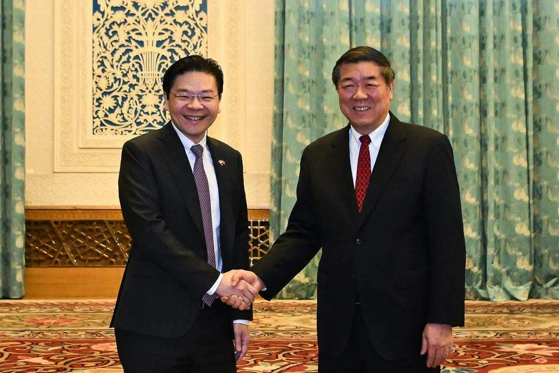 副总理兼财政部长黄循财星期三（12月6日）在北京和中共政治局委员、中国国务院副总理何立峰会面。（海峡时报）