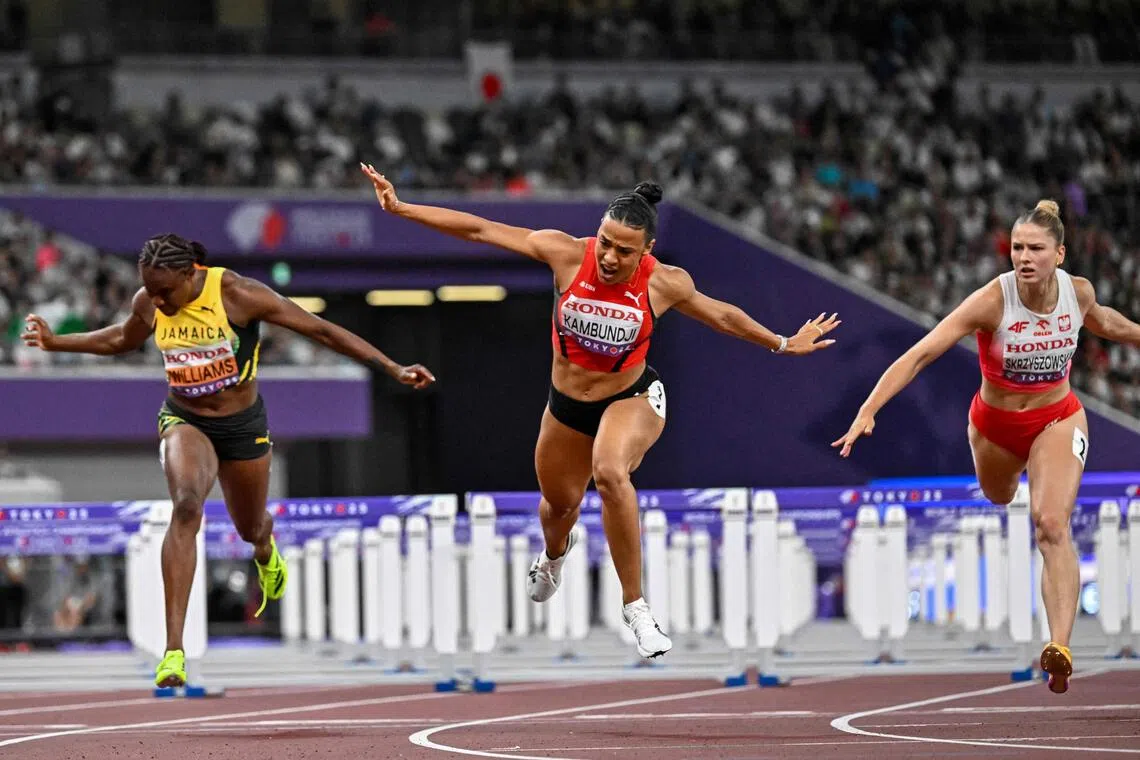 瑞士的迪塔吉(中）首次赢得世锦赛金牌。（法新社）