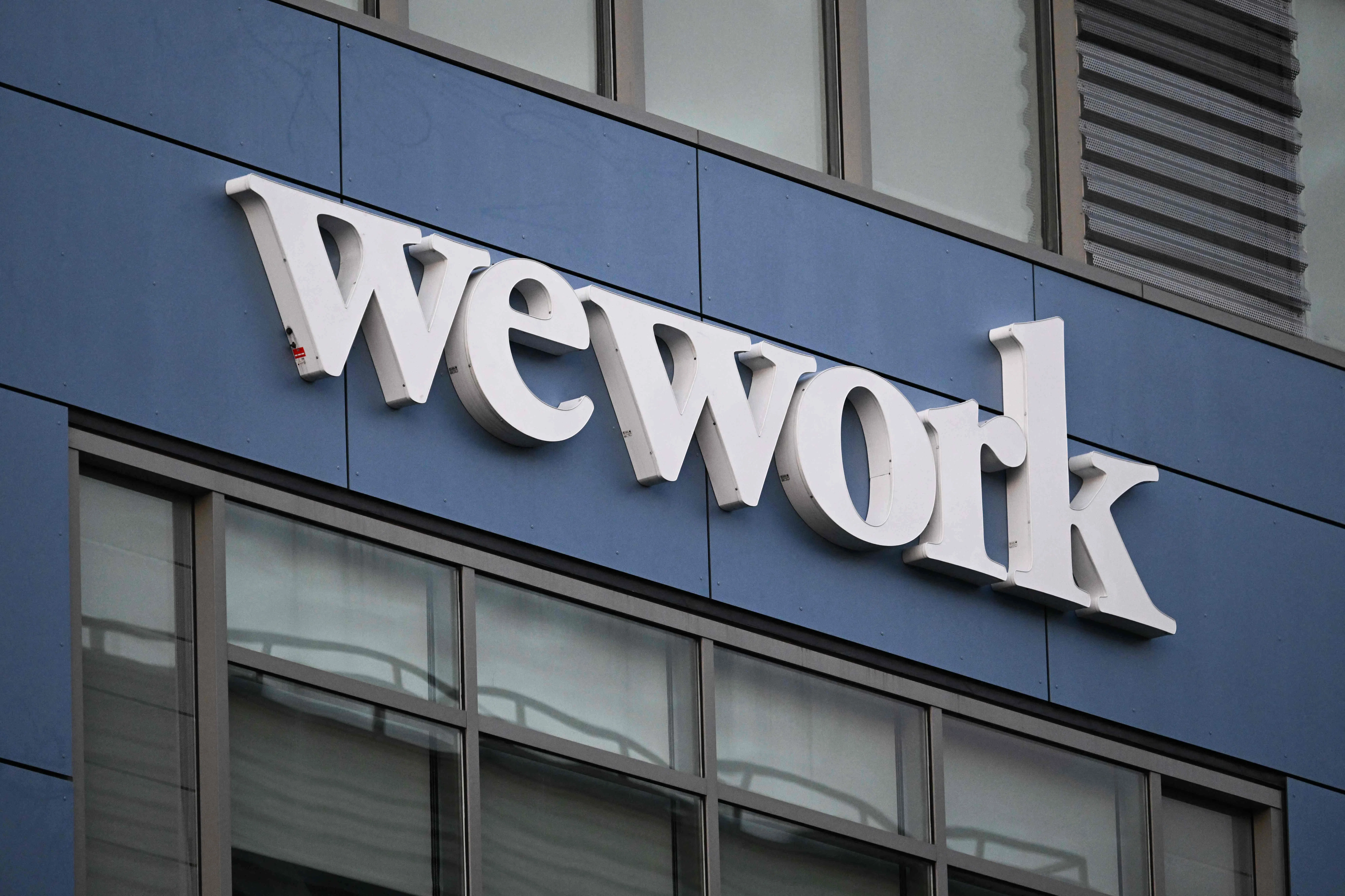 WeWork发布警告，基于公司的亏损状况和资金需求情况，该公司质疑自身持续经营的能力。（法新社）