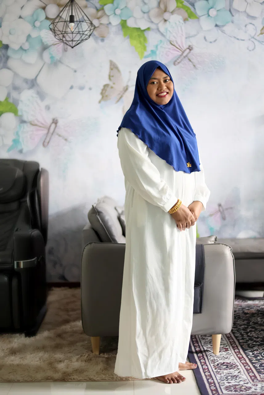 活跃于基层活动的蒂詹发现，这些年的“甘榜精神”越来越浓烈，社区内的居民也更愿意聚集在一起参加活动。（龙国雄摄）