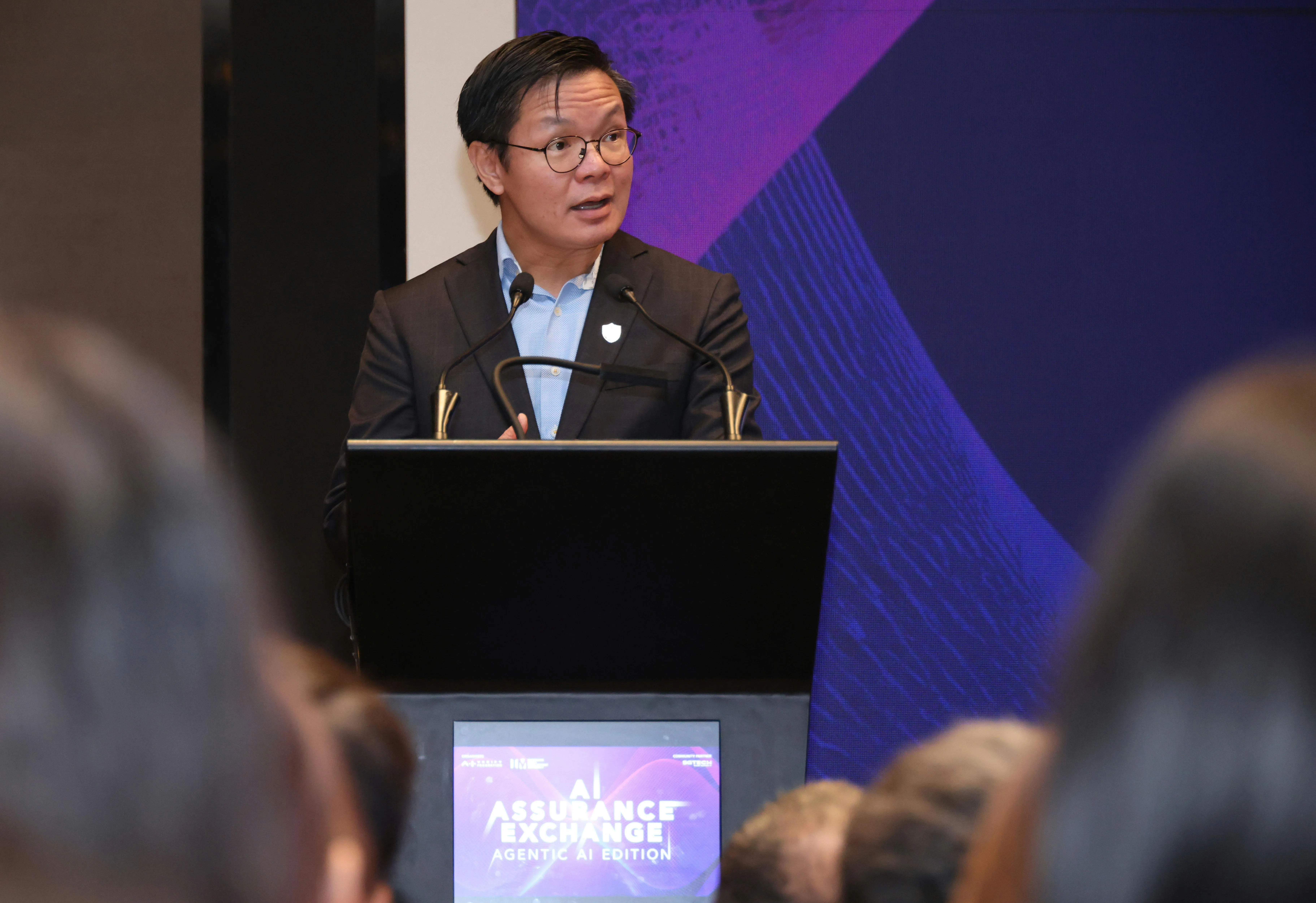 资讯通信媒体发展局局长黄子鹏星期三为AI Assurance Exchange活动致辞时说，新AI代理的出现意味着相关测试须进一步调整，不仅评估它是否得出正确结果，也须检视如何达到这个结果。（梁麒麟摄）