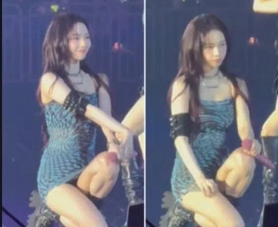 Karina在发现台下有人偷拍裙底，瞬间变脸怒瞪。（互联网）