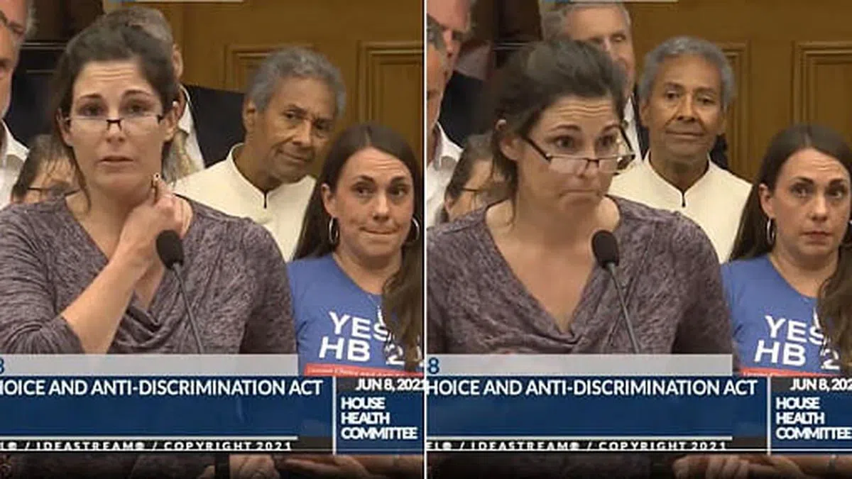 自称是护士的女子在俄亥俄州议会大厦一边质问：“解释为什么钥匙会粘在我身上？”，一边不断尝试将钥匙粘在她的脖子上，而钥匙却一再掉下来。（视频截图）