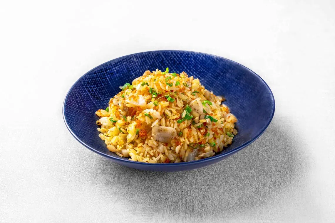 乐餐馆的鱼子带子蛋炒饭，食材升级也考炒功。（餐馆提供）