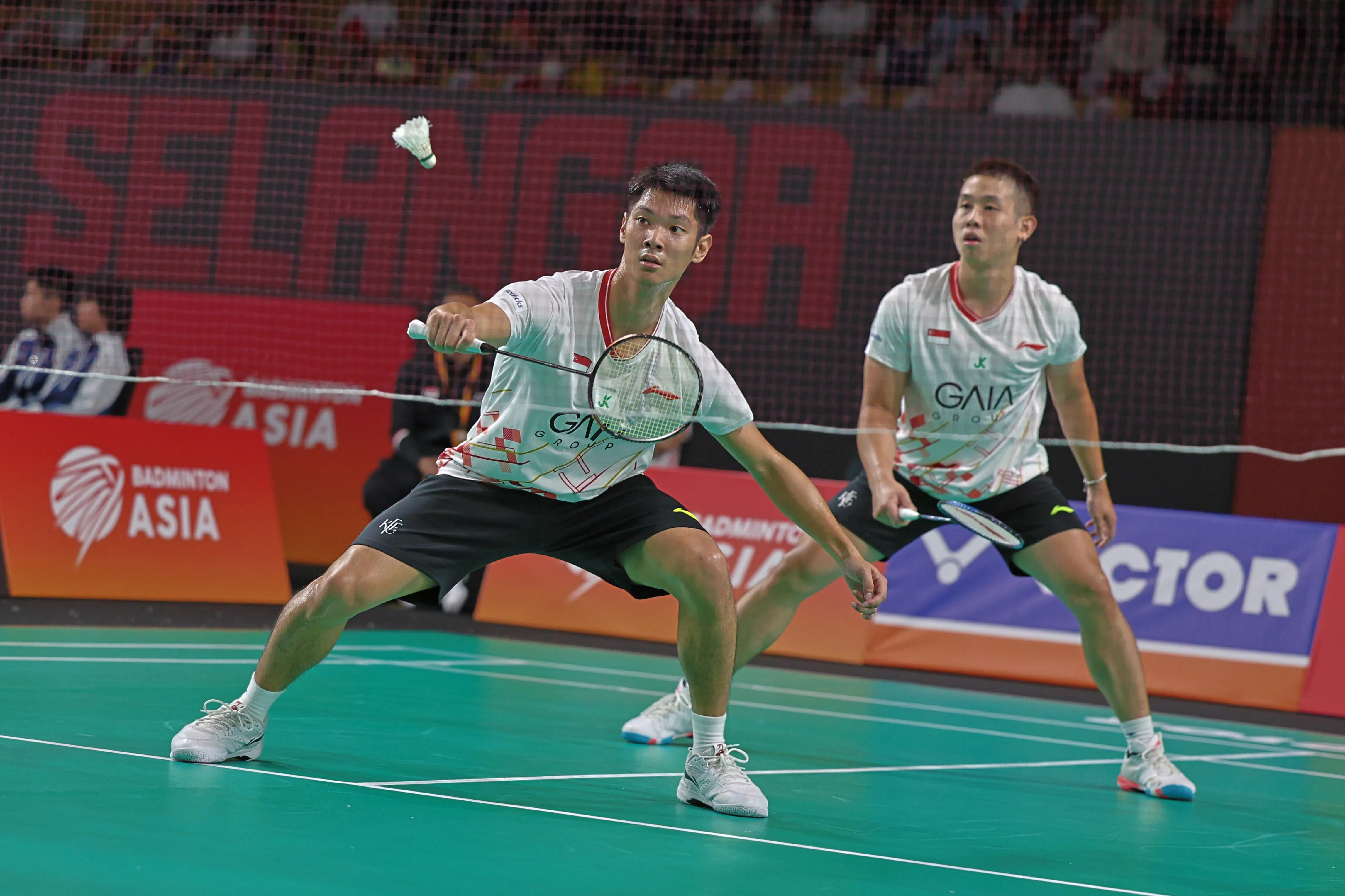 我国男双组合骆建贤（右）／黄家豪在比赛中回球。（陈芷馨摄）