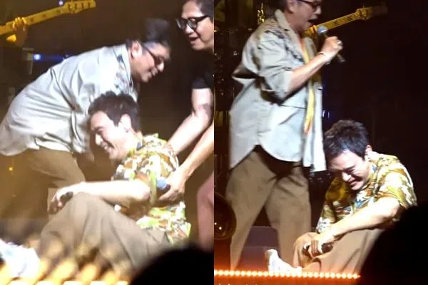 钟镇涛在温拿五虎告别巡演中不慎跌倒，谭咏麟及陈友来帮忙扶他。（互联网）
