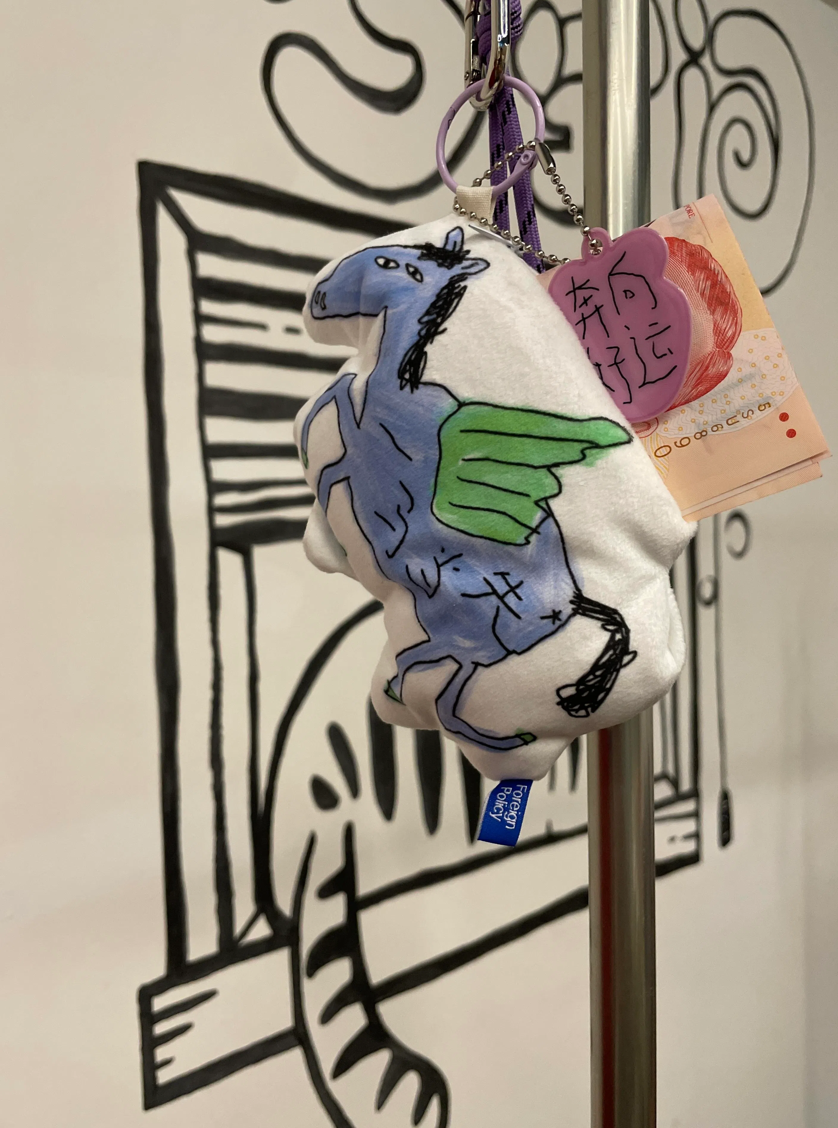 Foreign Policy设计的马年挂饰红包。童趣的马儿与字体是事务所设计师的创作，灵感来自创总余雅琳的爱女。（林方伟摄）