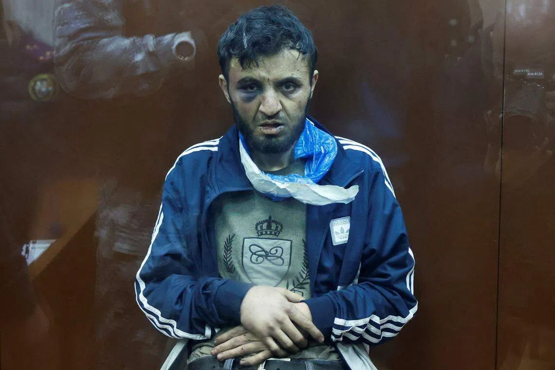 直接参与莫斯科音乐厅袭击的四名嫌犯分别出庭面控，他们的脸部都有明显淤青和伤势，图为嫌犯之一米尔佐耶夫，他已经认罪。（路透社）