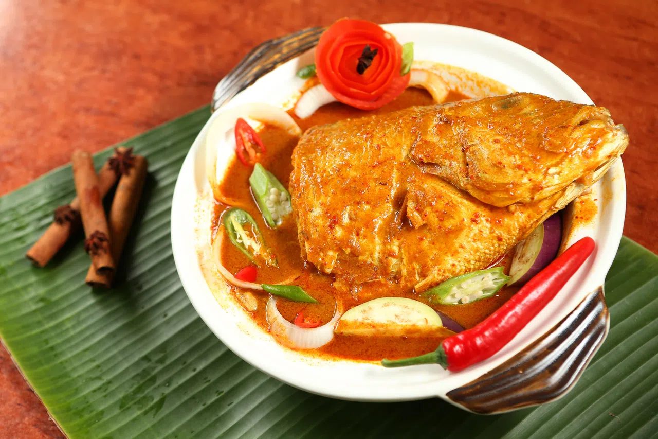 爱国，从来不是什么抽象的概念，它可能是舌头记住的咖喱鱼头辛辣。（档案照）