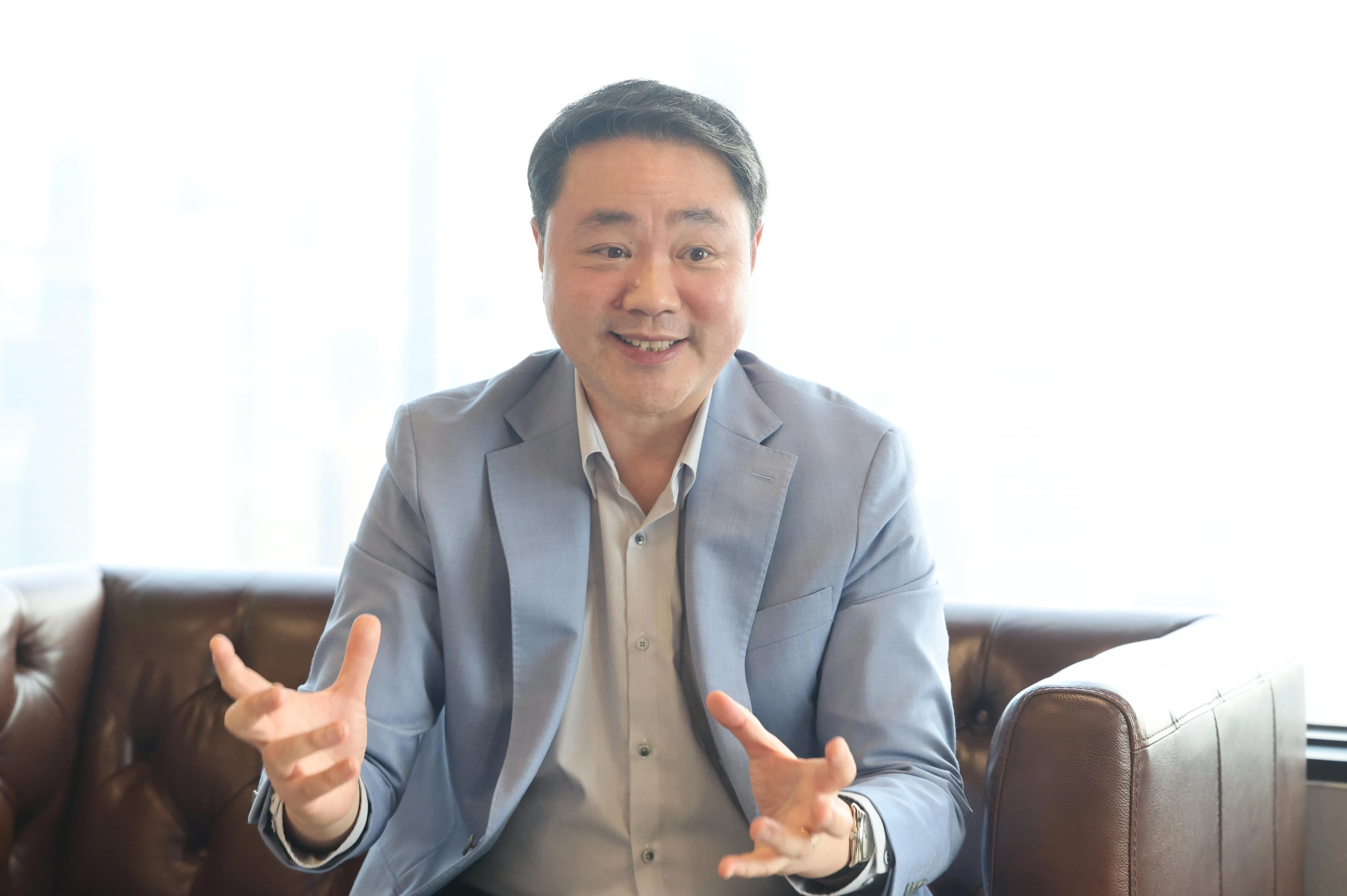 谭文俊指出，公司的增长主要源于积极参与新加坡的AI发展前景。（唐家鸿摄）