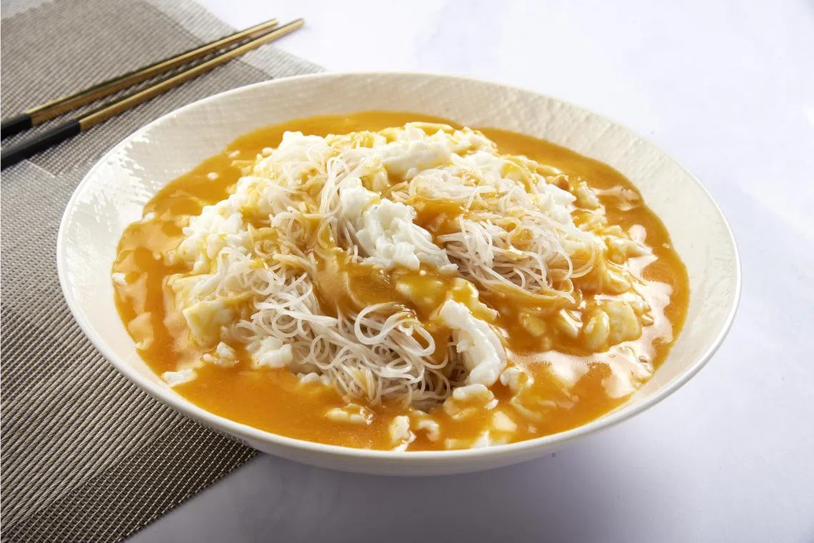 店小二臻选的主打之一，蟹黄赛螃蟹米粉。（餐馆提供）