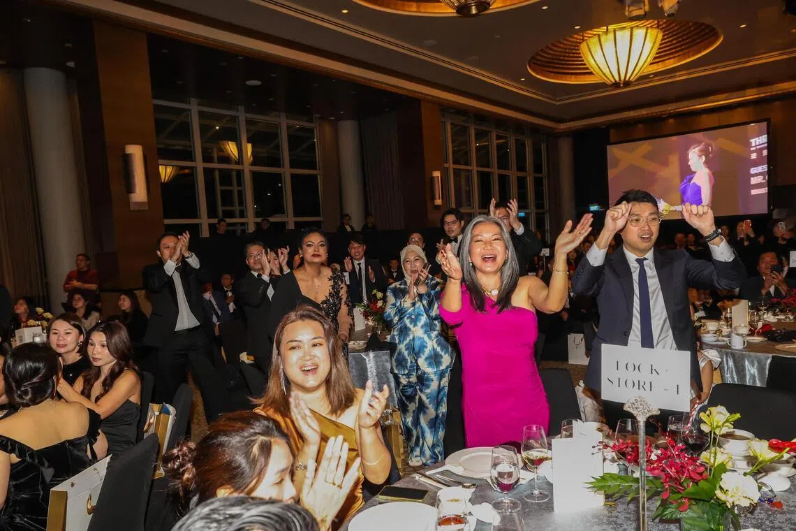 宾客纷纷为自家品牌喝彩。（陈斌勤摄）