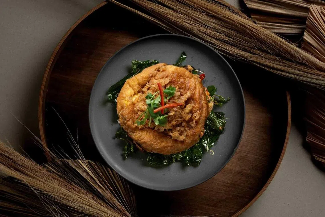 蟹肉煎蛋包，外层松脆，内里软嫩湿润。（餐馆提供）