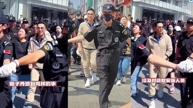 甄子丹10月到沈阳出席活动，身边围了十多名保安人员。（互联网）