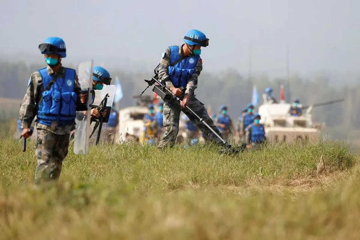 中国解放军士兵昨天与来自巴基斯坦、蒙古和泰国的军队一起参加多边实兵演习。（路透社） 