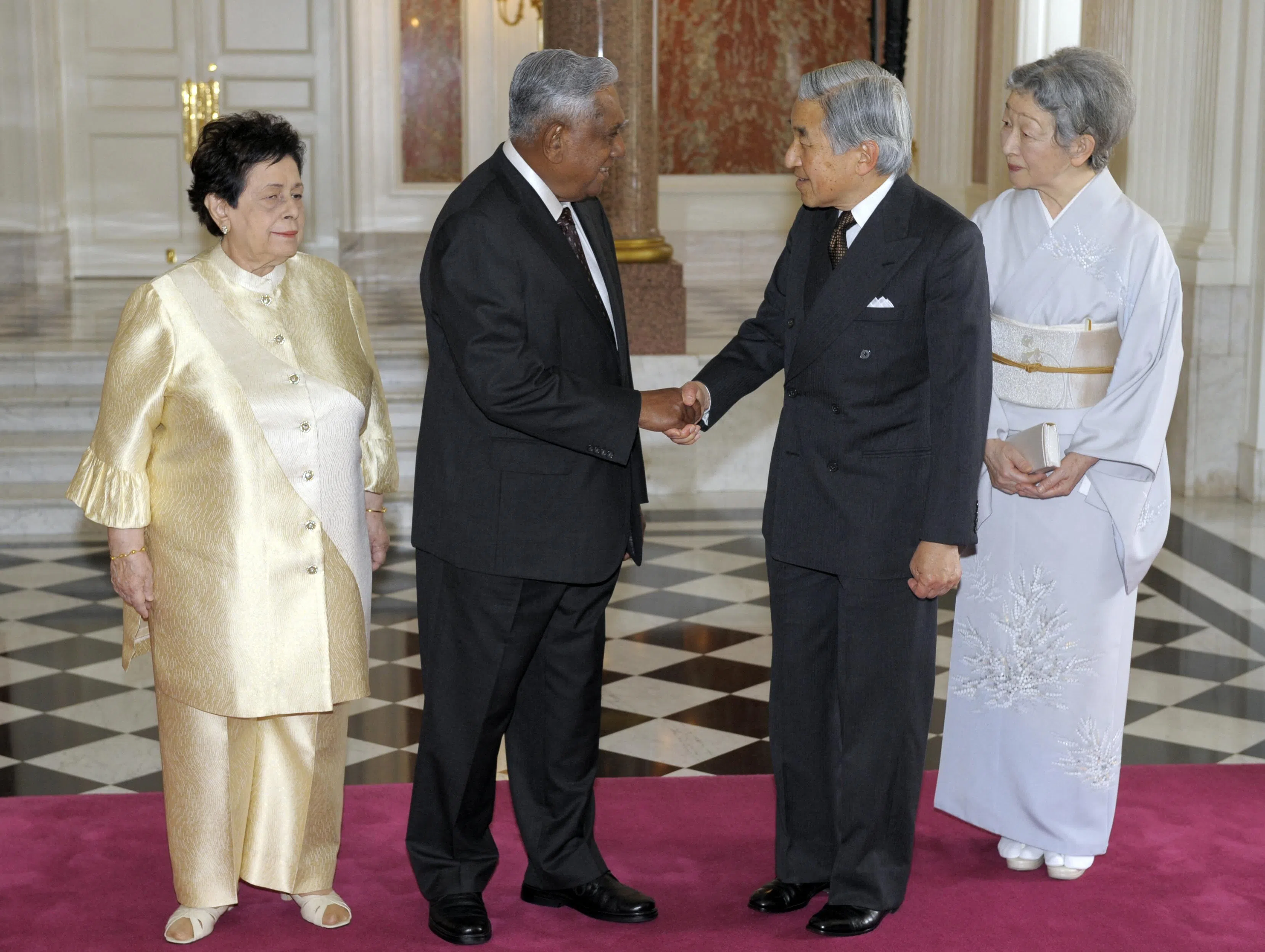 Mr Nathan and his wife made a state visit to Japan in May 2009. Nathan (second from left) shakes hands with Emperor Akihito (second from right) and Empress Michiko at the Akasaka State Guest House on 13 May, as he concludes the Tokyo leg of his visit.（AFP file picture）
