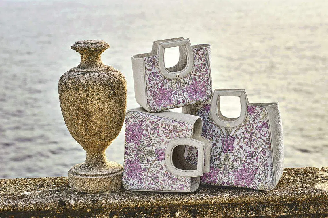 Aigner的Nova系列包包方形和圆形混合的顶把十分可爱。（品牌提供）