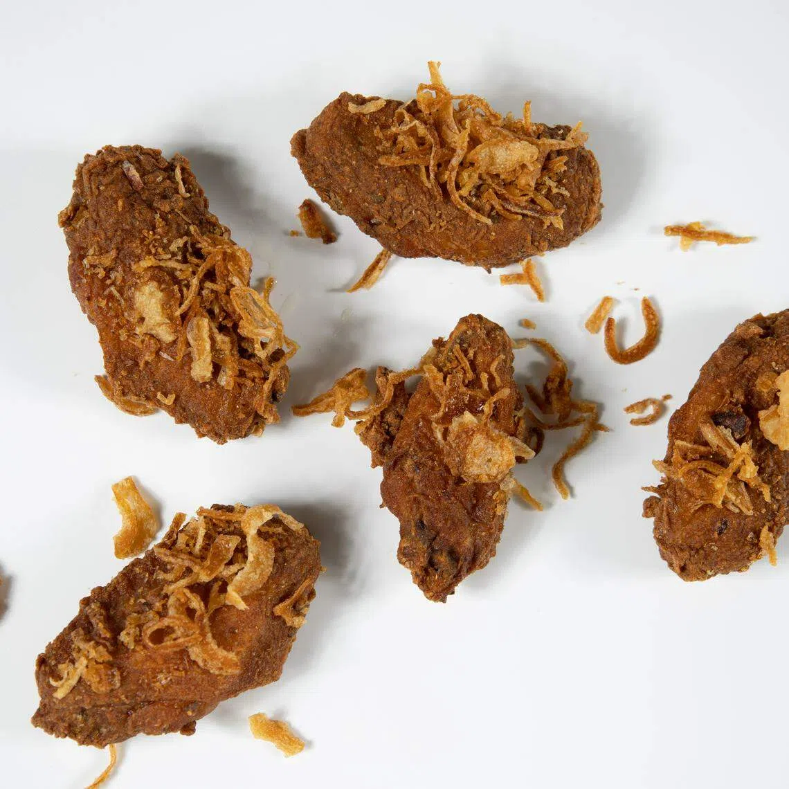 鹏泰超市12月1日迎来新美食档口Good Gai，售卖泰式炸鸡，合艾炸鸡上有炸葱头，增添美味。（受访者提供）