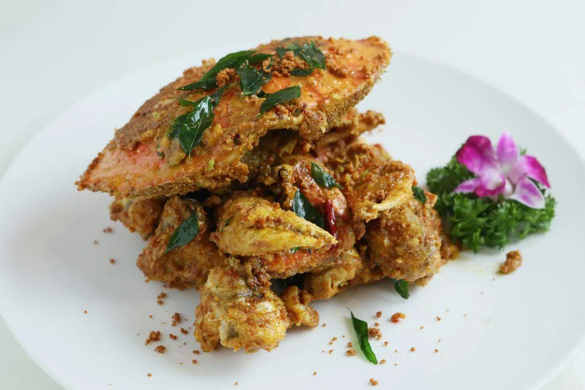 泰式奶油珍宝蟹以泰国咖喱粉、奶油和多种香料烹制。（龙国雄摄）