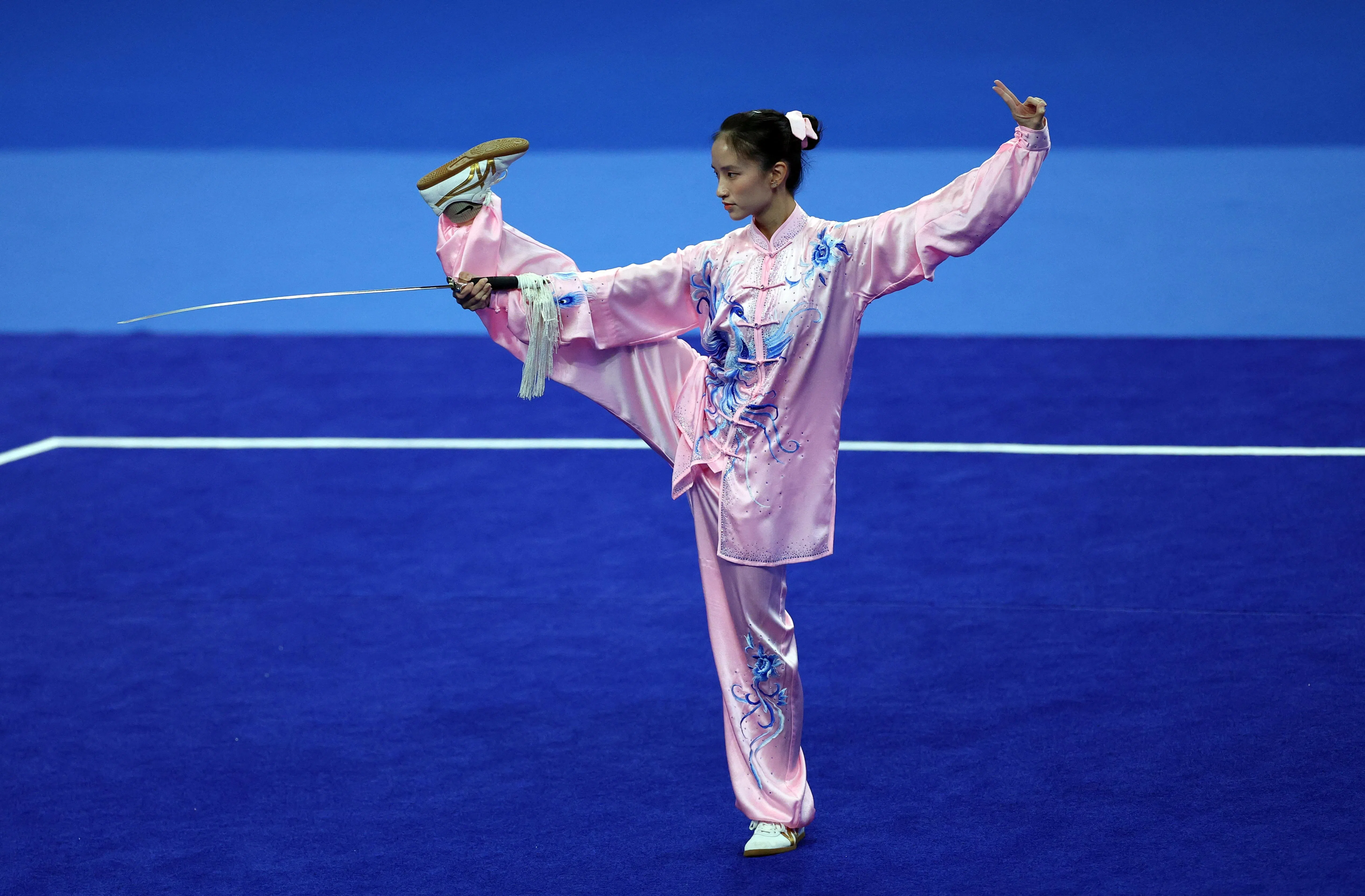 我国选手陈彦凝在太极剑决赛中收获全场第五高的9.703分，最终以18.953分排在九名选手中的第八名。（路透社）