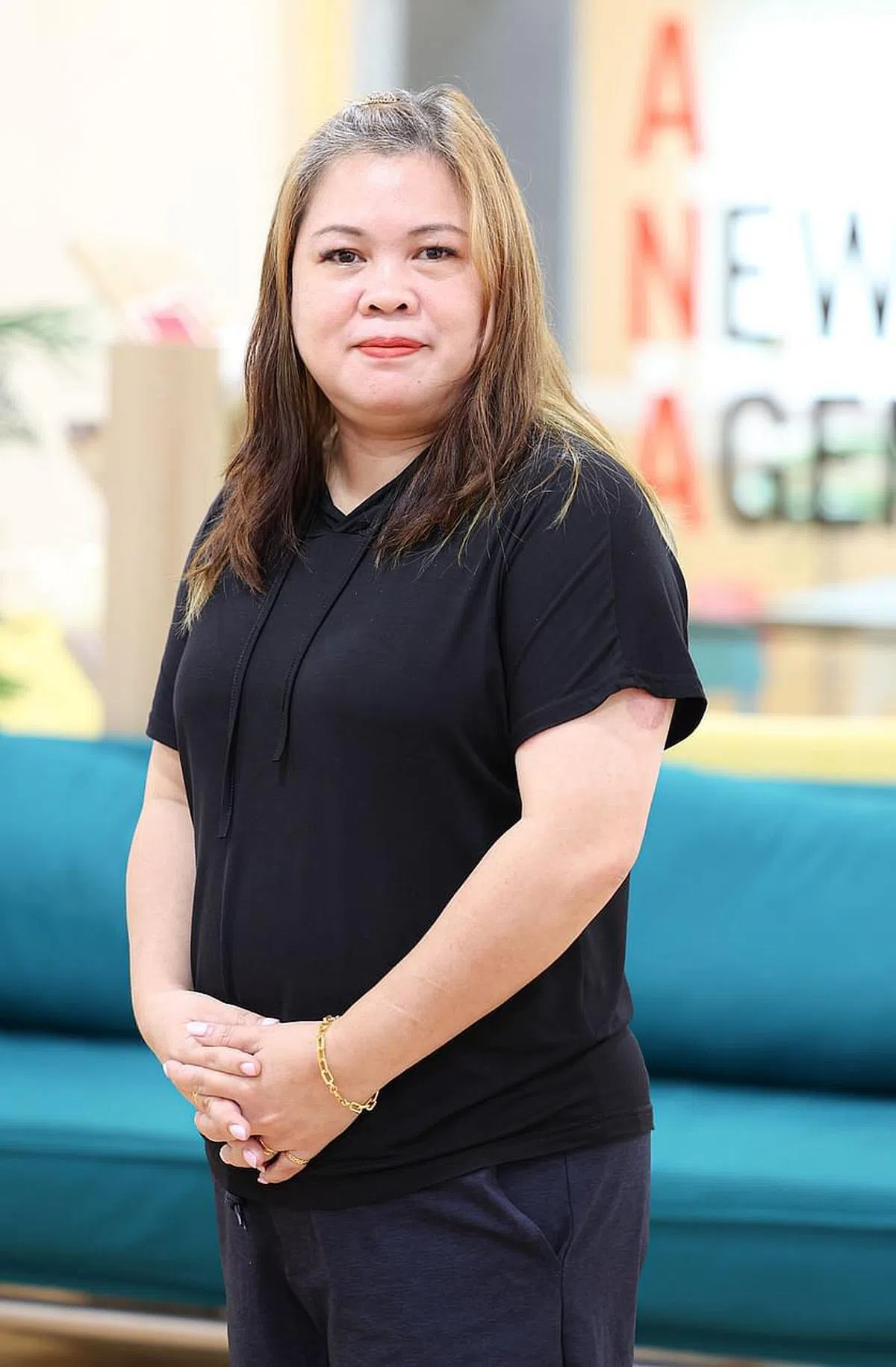 曾怕再也见不到母亲，黄艳萍戒毒后展开新生活。 （李冠卫摄）