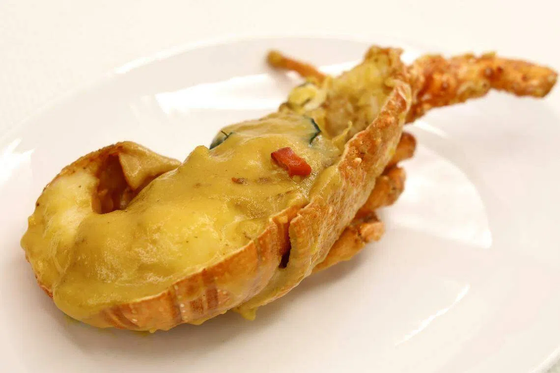 香柠奶油龙虾是以餐馆招牌酱汁烹制而成，滋味鲜美。（特约陈来福摄）