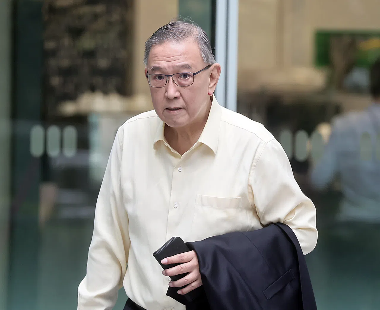 慈善理事会前主席余福金说，是他说服林智强与女创作歌手见面的。（海峡时报）
