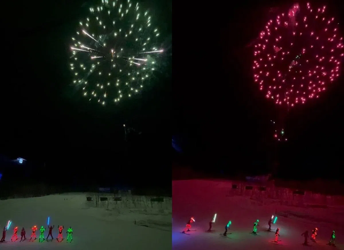 度假村晚间的烟花秀，工作人员穿上荧光服装在滑雪场表演，给访客留下深刻的印象。（曾慧仪摄）