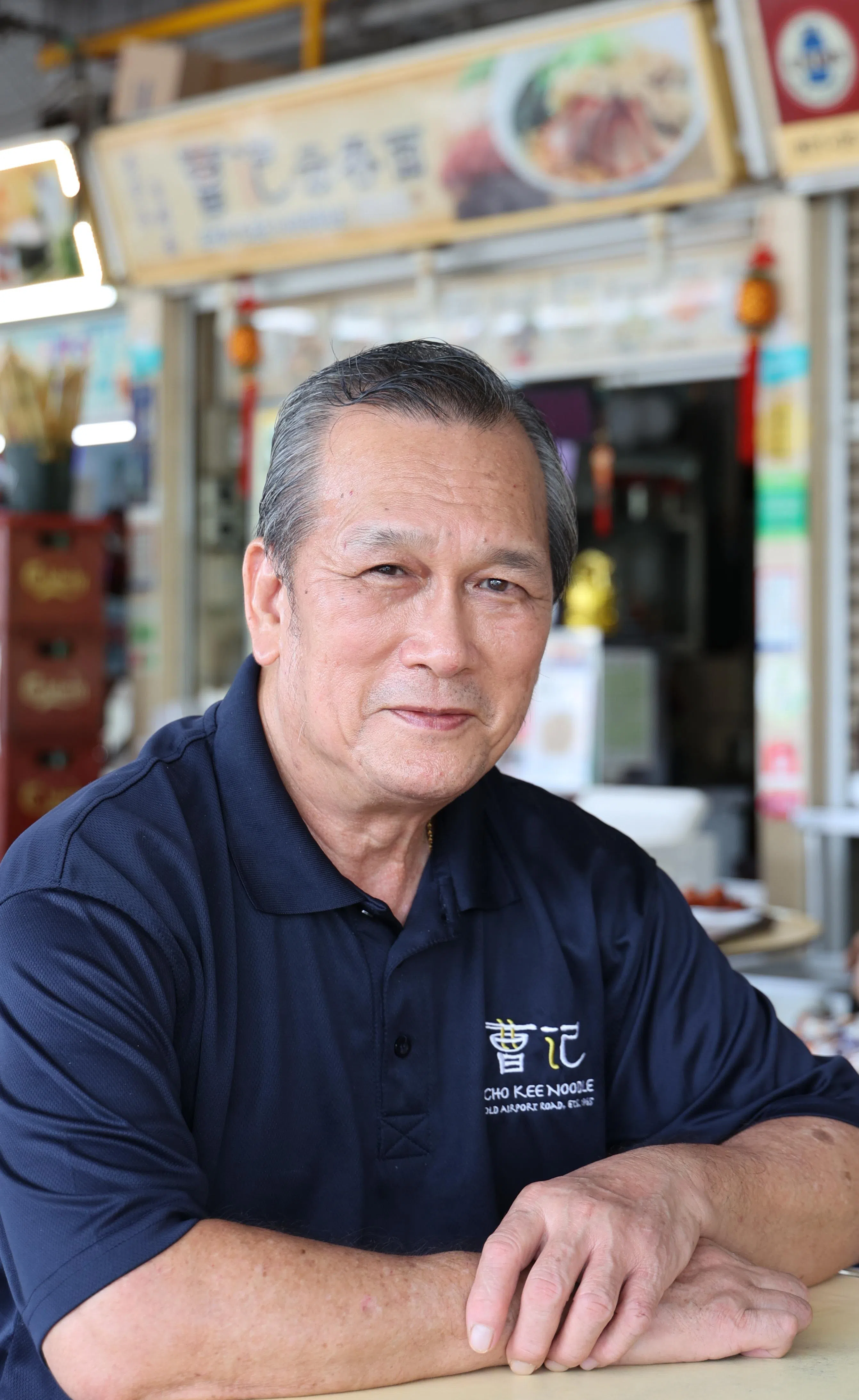 60年老字号曹记云吞面第二代摊主曹锦光感激政府在1970年代兴建小贩中心。（档案照片）