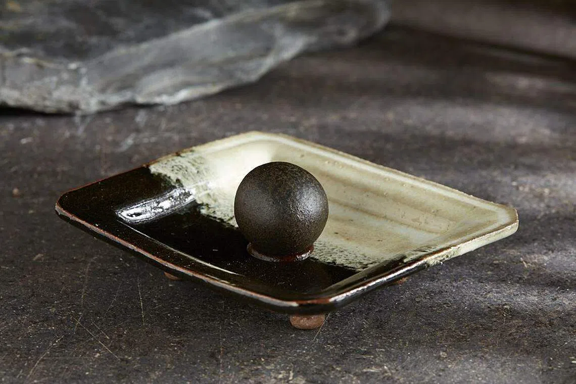 新加坡菜单上的Singa Dog肉球，是La Cime招牌菜血肠Boudin Dog的另一版本。（餐馆提供）