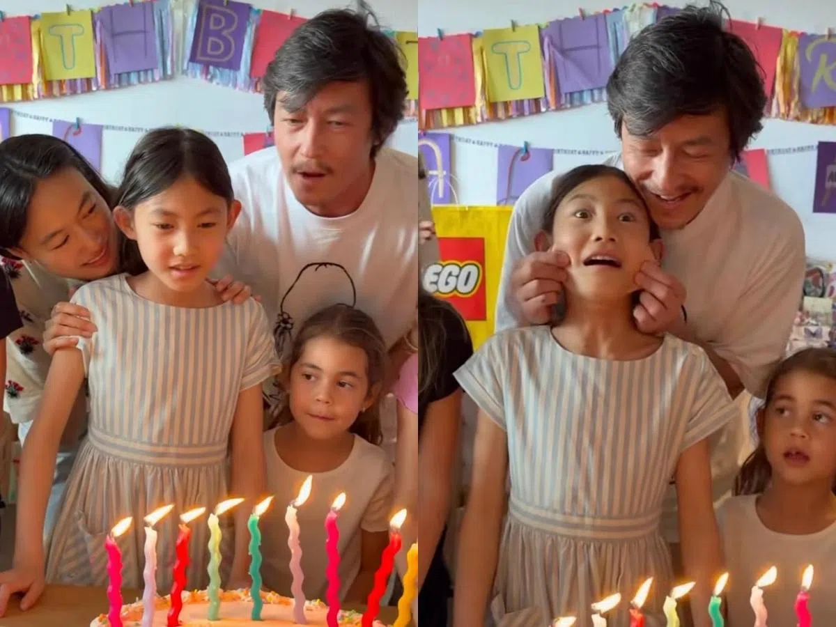 唱生日歌时陈冠希捏着爱女的脸颊（右图）。（互联网）