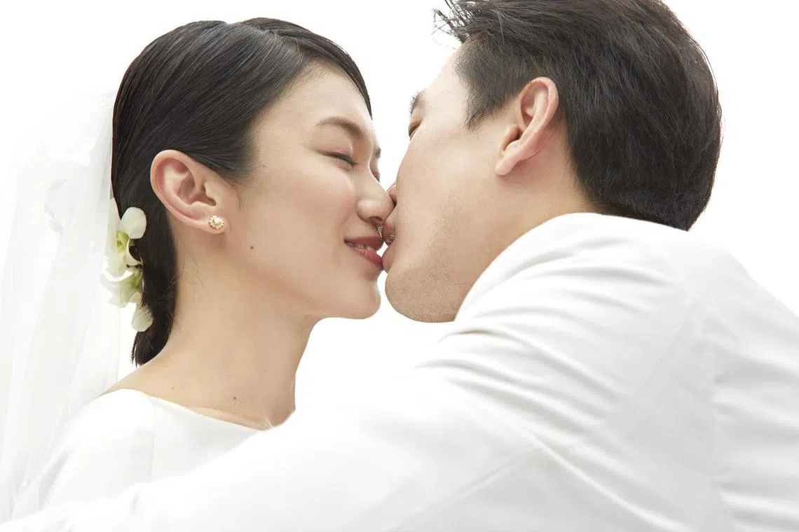 白薇秀和戚玉武2014年9月9日下午3点半在圣淘沙注册结婚。（档案照）