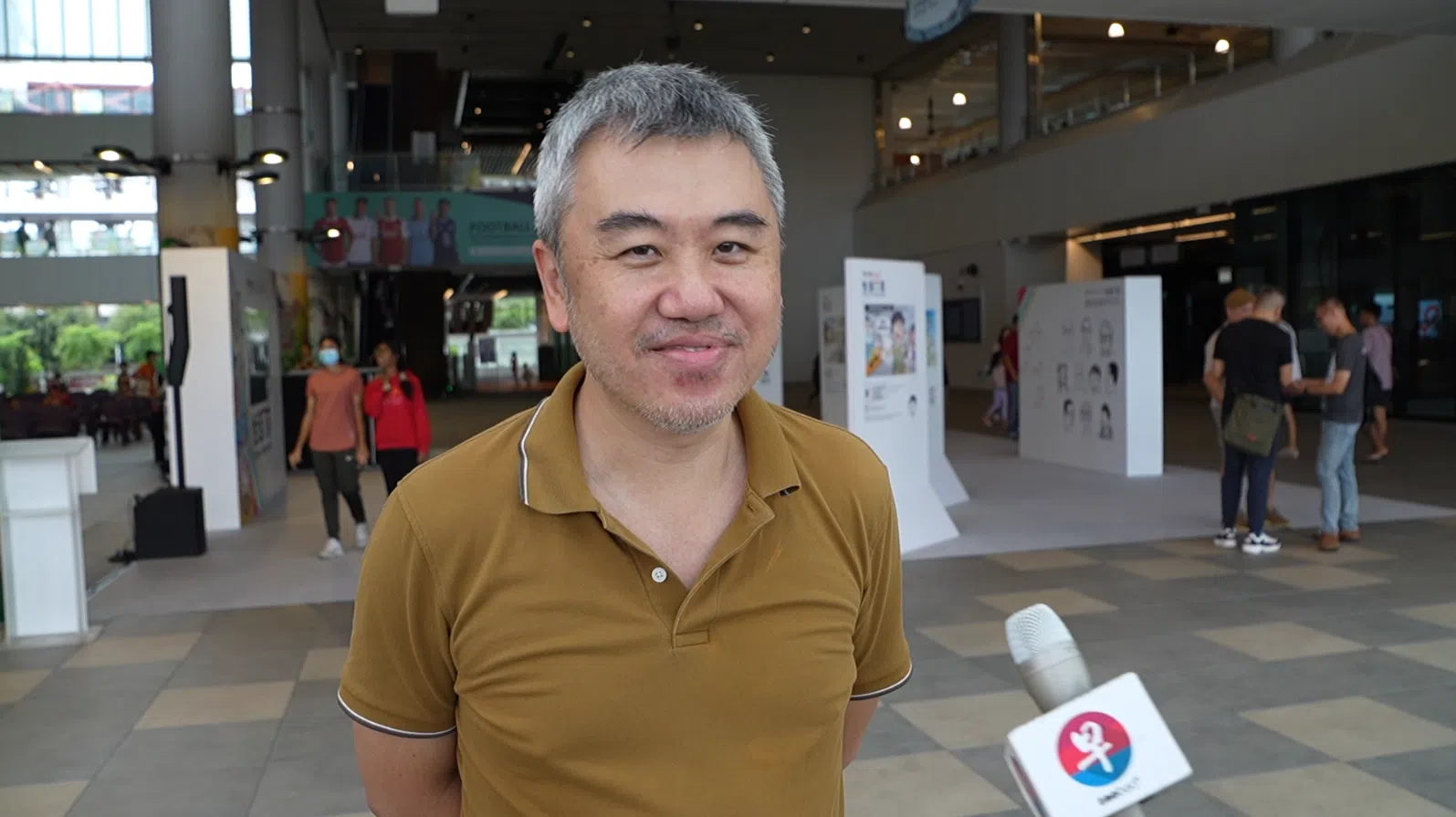 出席《联合早报》举办的“生活百态”漫画展的读者林增如。