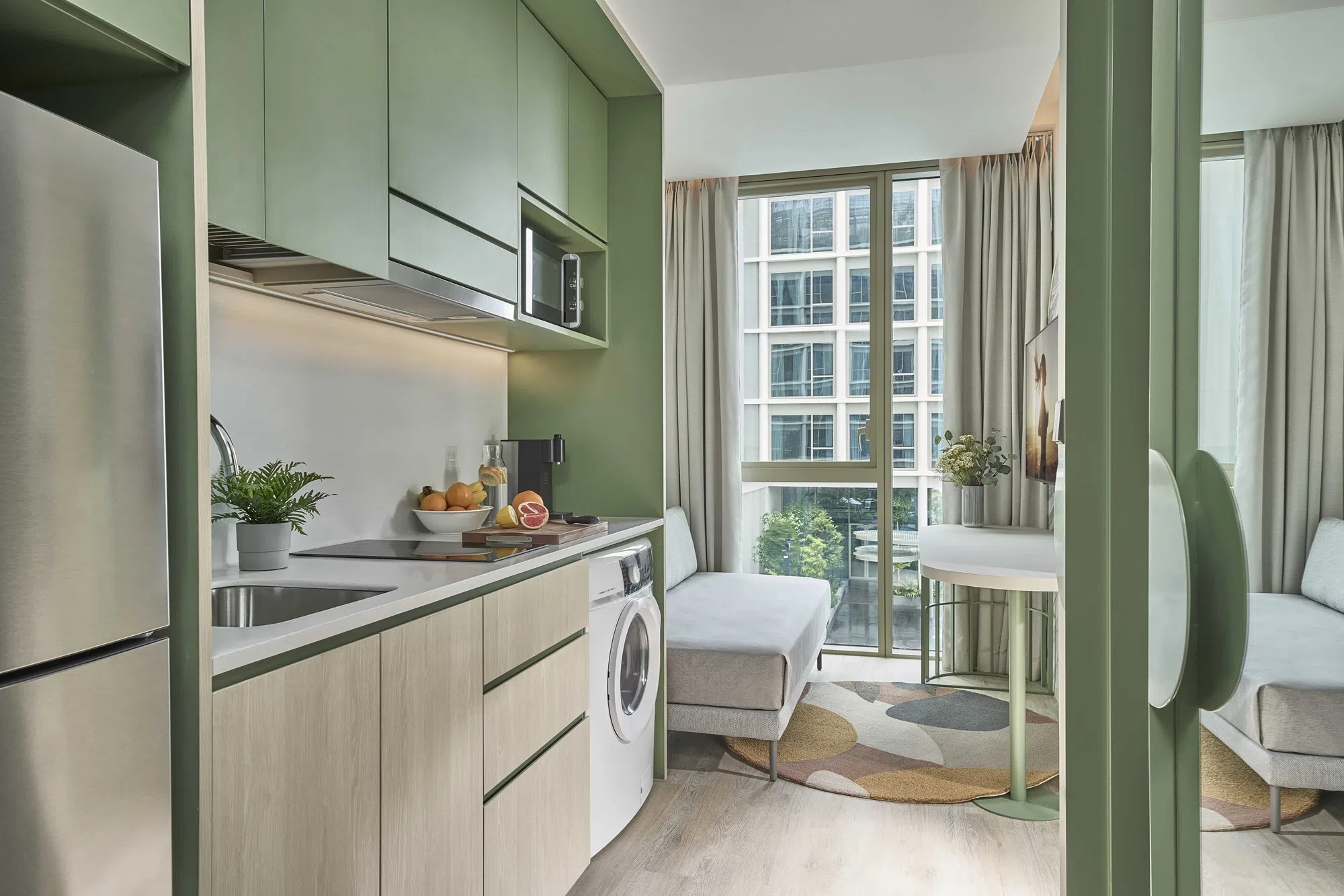 公寓酒店的部分房型配备小厨房，让喜爱下厨的住客可以自己准备美食。（图/新加坡馨乐庭科学院公寓酒店提供）