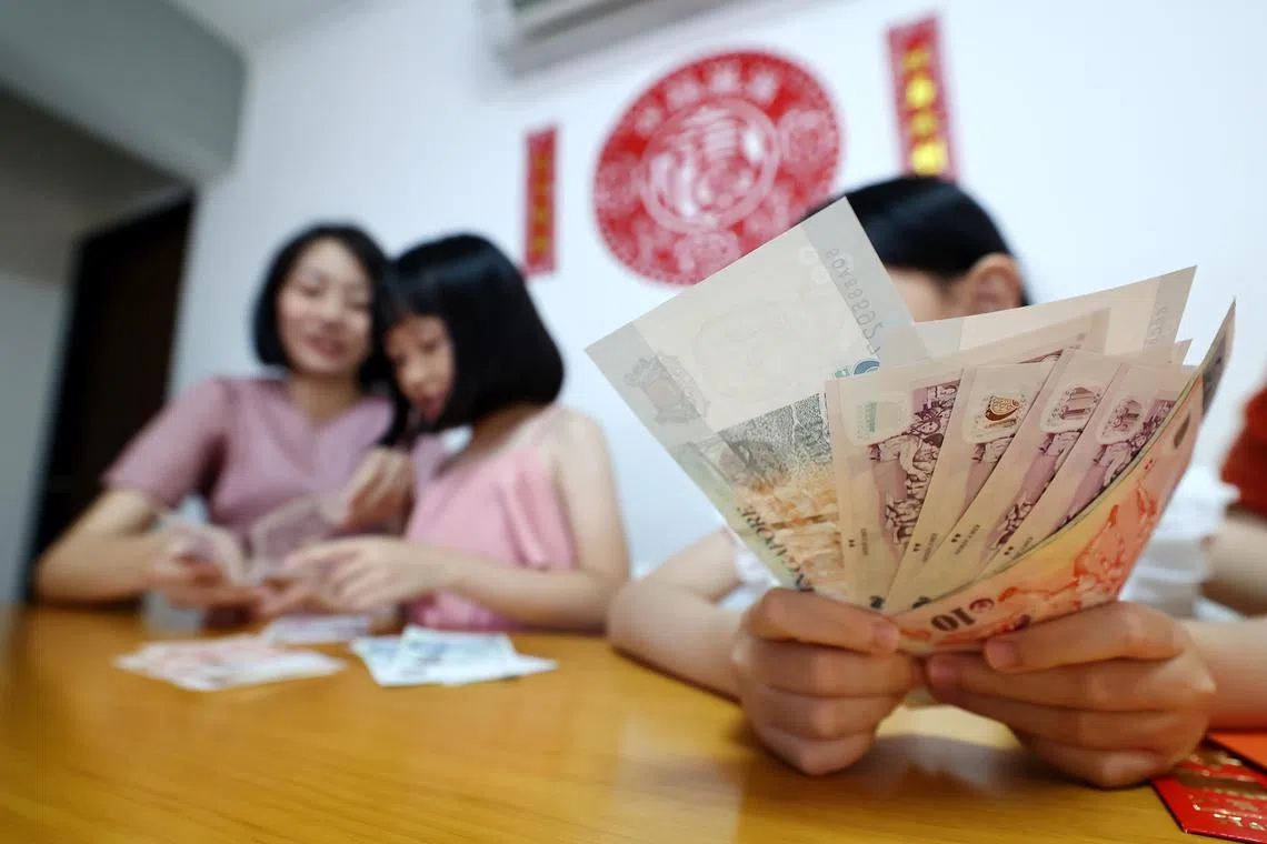 张美芳不担心父母对孩子说“我帮你存起来”，会让孩子有“红包被没收”的感觉。（陈渊庄摄）